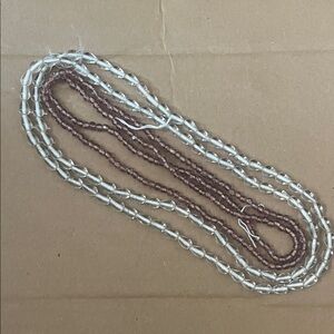 Glass beads. Clear drops and pink cubes.